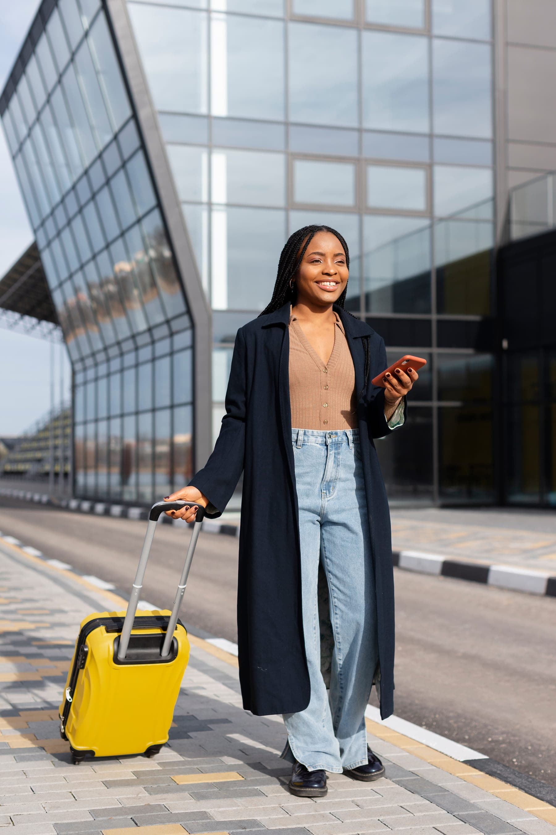 A nurse arriving in the UK with her luggage